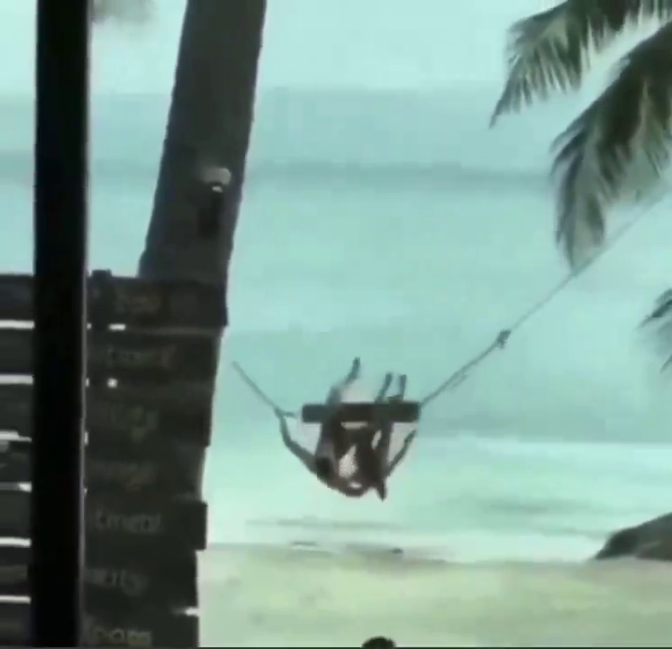 Taylor Swift and Travis Kelce enjoy a swing ride on vacation in the Bahamas and falls off