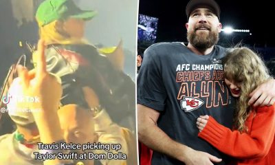 Travis Kelce lifts Taylor Swift up in the air