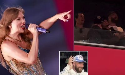 Taylor Swift pointing to Travis Kelce
