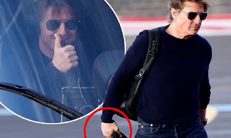 Tom Cruise suffers painful-looking hand injury as he arrives to London on his helicopter as he continues filming for Mission Impossible after rare appearance with his sister Marian